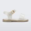 Side view of a white Mini Melissa Mar Sandal with two straps and a gold buckle.