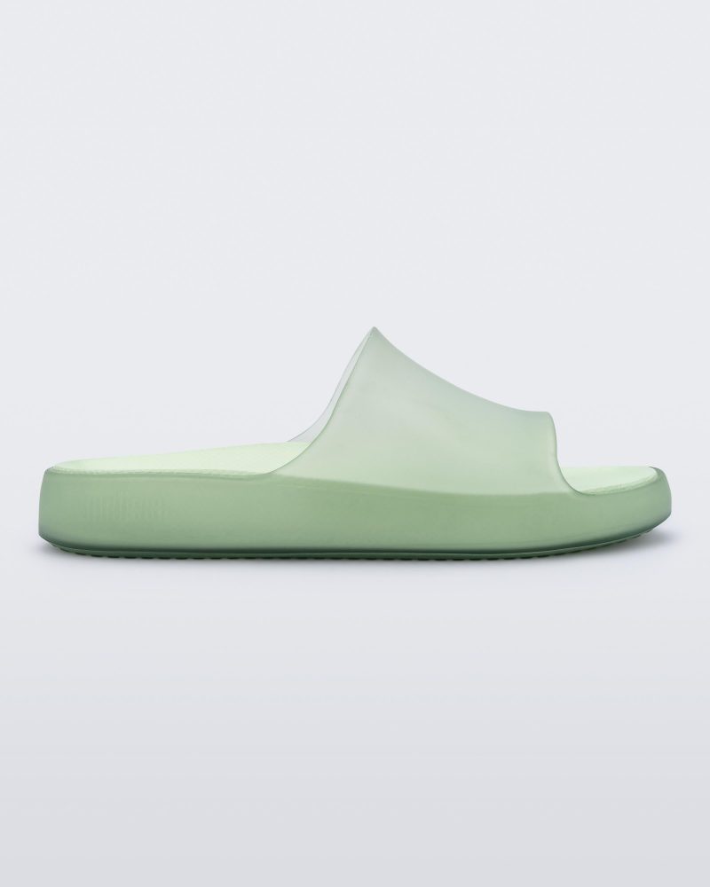 Side view of a transparent green Melissa Cloud slide.