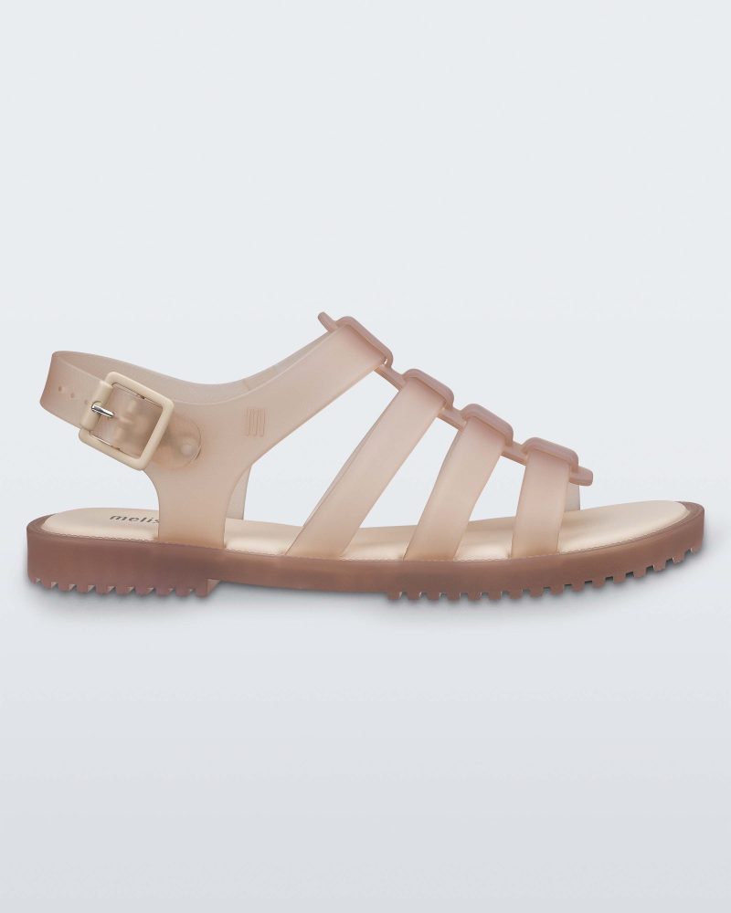 Side view of a beige Melissa Flox sandal with straps.