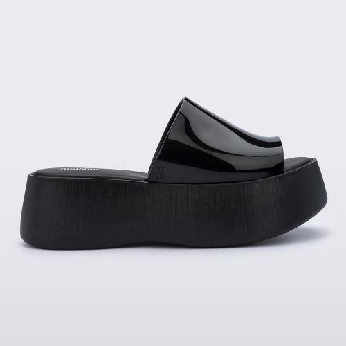 Side view of a black Melissa Becky platform slide.