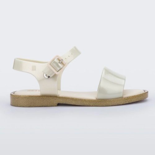 Side view of a beige Mini Melissa Mar Sandal with gold glitter outsole.